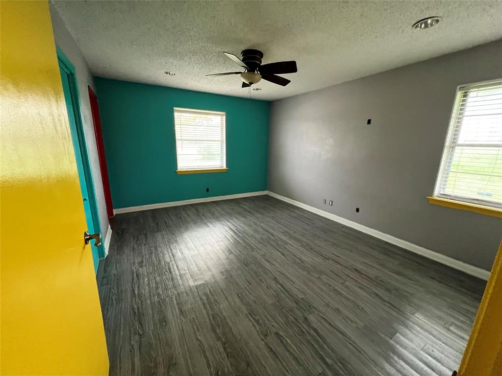 5811 Horizon Road Rockwall, TX 75032 - Photo 19 of 30 a view of empty room with wooden floor and fan