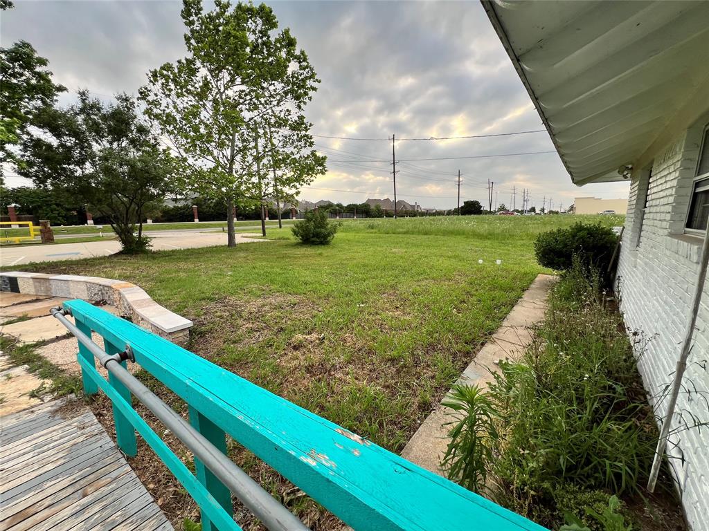 5811 Horizon Road Rockwall, TX 75032 - Photo 24 of 30 a view of a garden with wooden deck