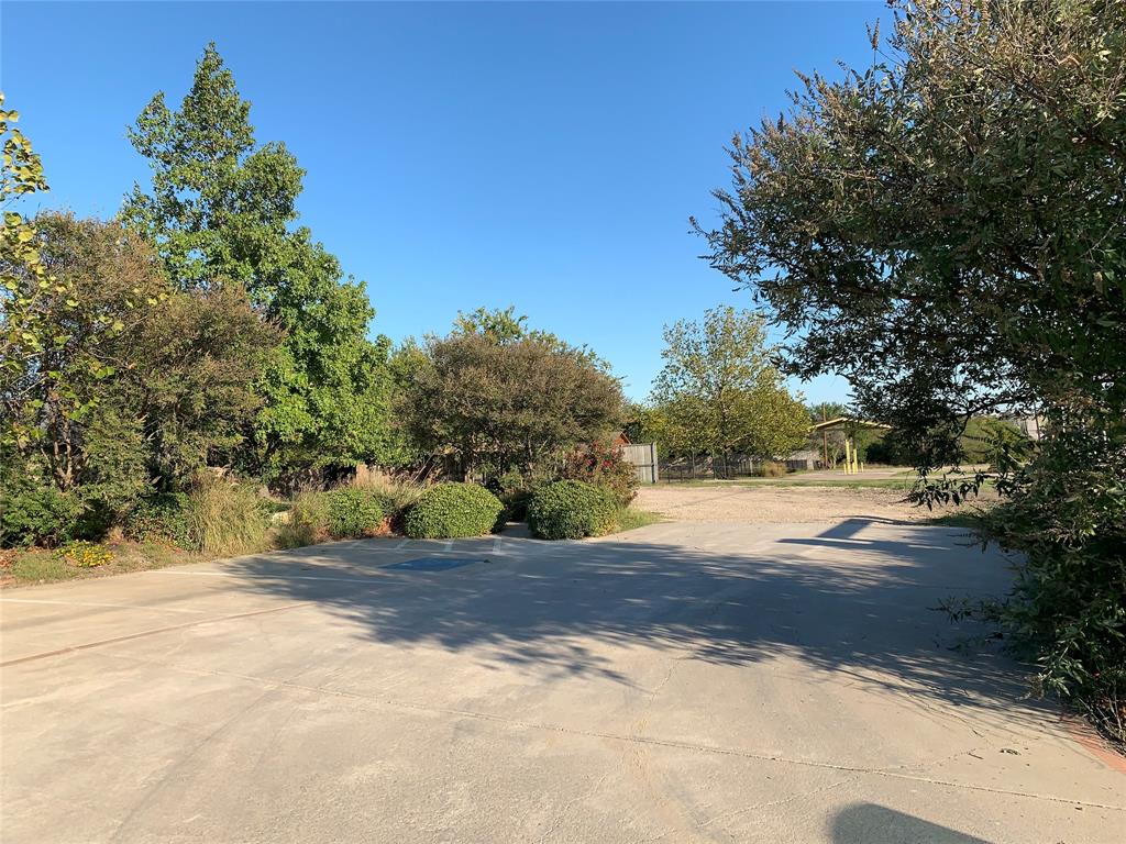 5811 Horizon Road Rockwall, TX 75032 - Photo 7 of 30 a view of a yard with plants and trees