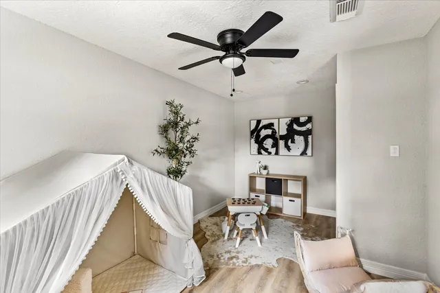 a bedroom with furniture and a window