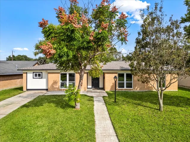 front view of a house with a yard