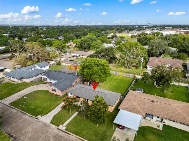 an aerial view of a house with a garden