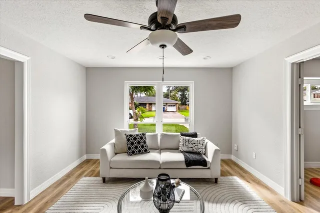 a living room with furniture and a window