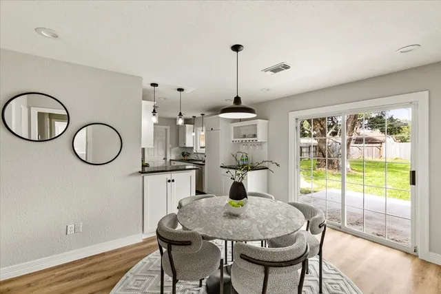 a very nice looking dining room with a table and chairs