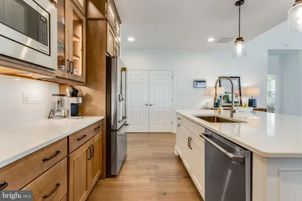 a spacious bathroom with a double vanity sink mirror and toilet