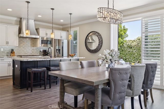 a kitchen with stainless steel appliances granite countertop a stove and a sink
