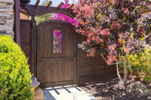 a front view of a house with outdoor seating