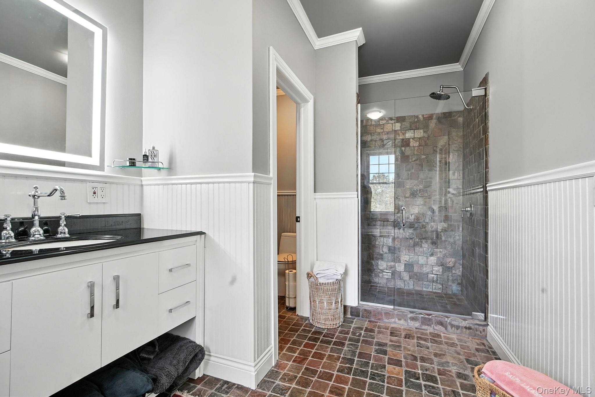 57 South White Rock Road Holmes, NY 12531 - Photo 26 of 44 a bathroom with a sink a toilet a mirror and shower