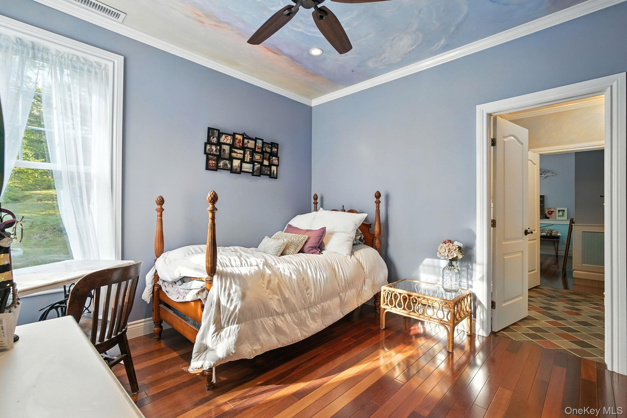 57 South White Rock Road Holmes, NY 12531 - Photo 27 of 44 a bedroom with a bed and wooden floor