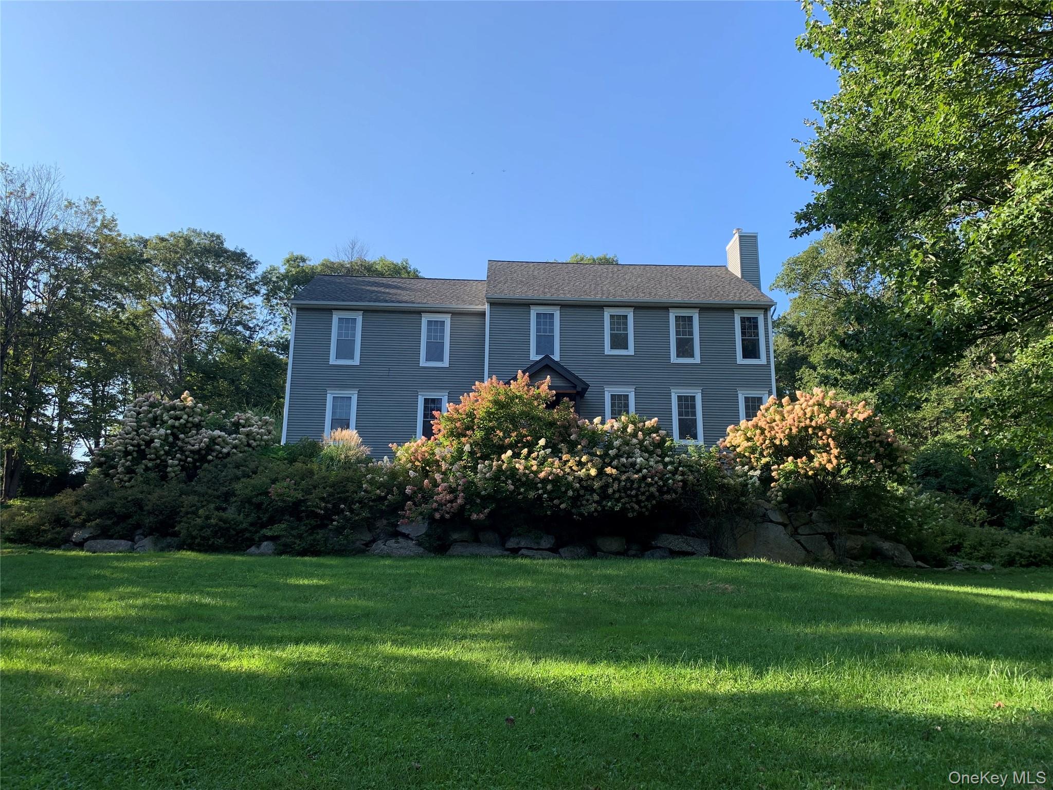 57 South White Rock Road Holmes, NY 12531 - Photo 30 of 44 a front view of a house with a garden