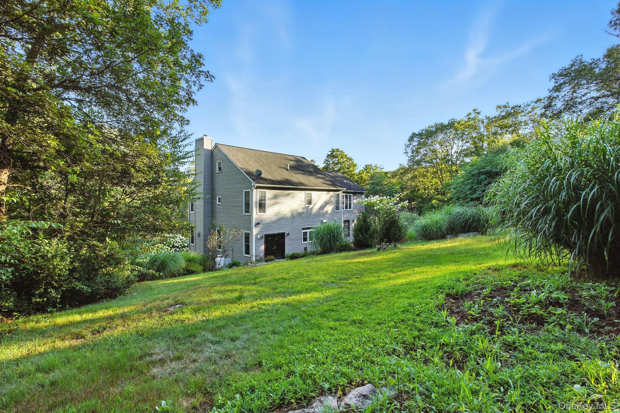 57 South White Rock Road Holmes, NY 12531 - Photo 34 of 44 a view of a house with a big yard plants and large trees