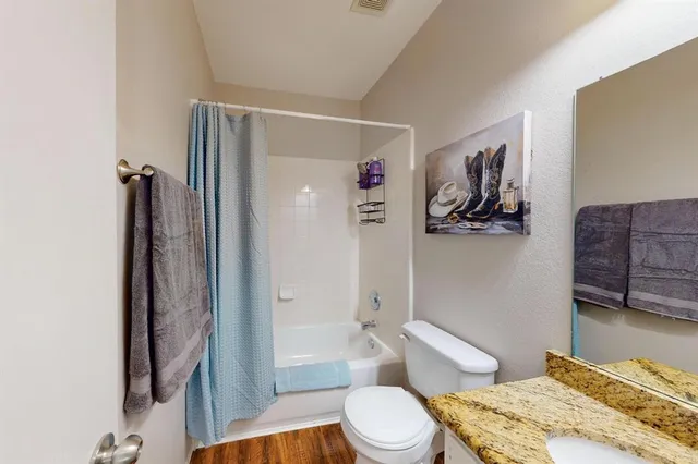 a bathroom with a toilet a sink and bathtub