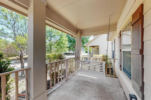 a view of porch with wooden floor and seating space