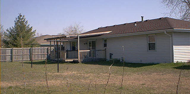 3989 Montclair Road Roscoe, IL 61073 - Photo 4 of 6 a front view of a house with a porch