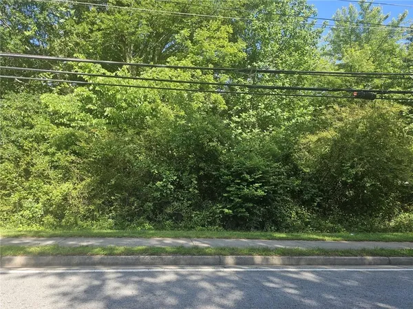 a view of a field with a trees