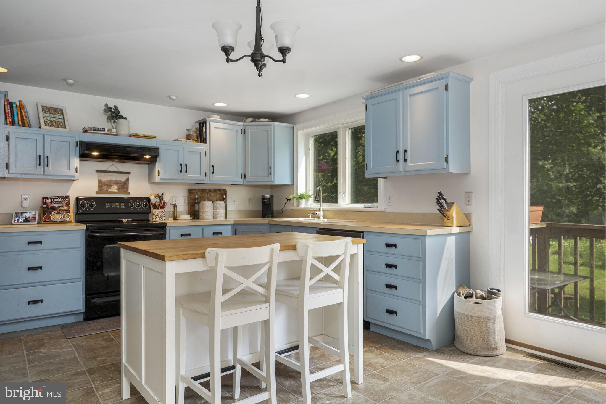 650 Fairview Road Glenmoore, PA 19343 - Photo 1 of 29 a kitchen with stainless steel appliances kitchen island granite countertop a sink and cabinets