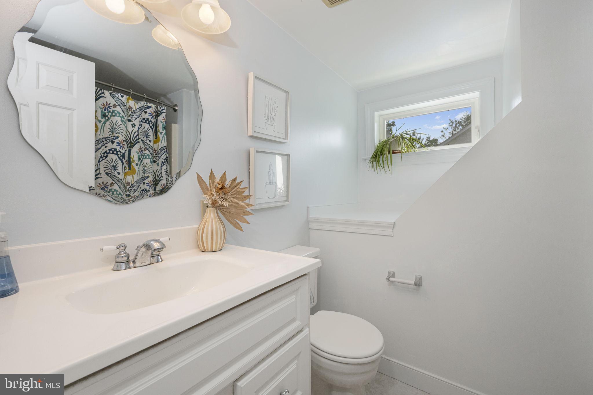 650 Fairview Road Glenmoore, PA 19343 - Photo 16 of 29 a bathroom with a sink mirror vanity and toilet