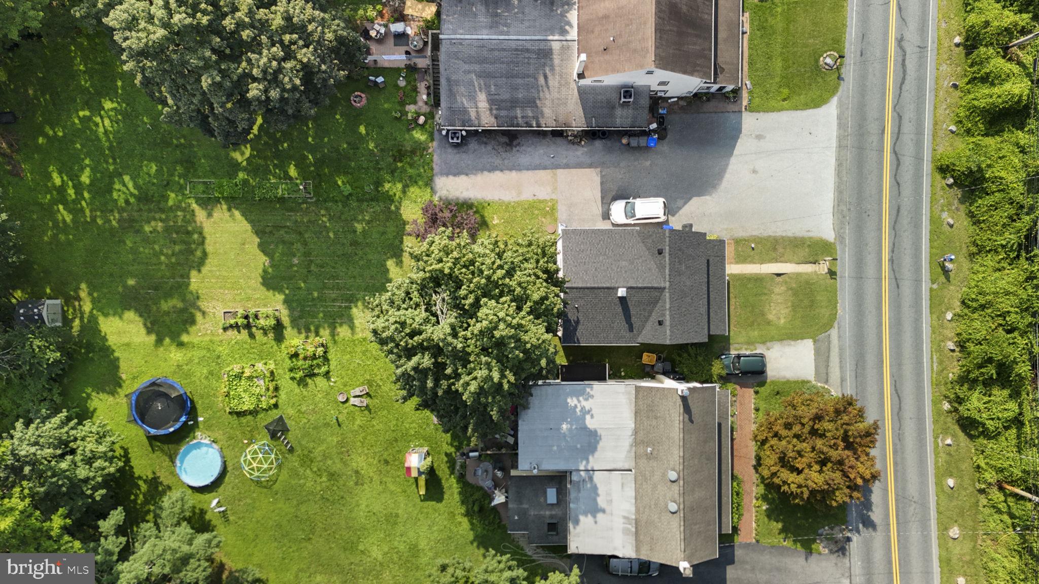 650 Fairview Road Glenmoore, PA 19343 - Photo 24 of 29 aerial view of a house with pool and garden