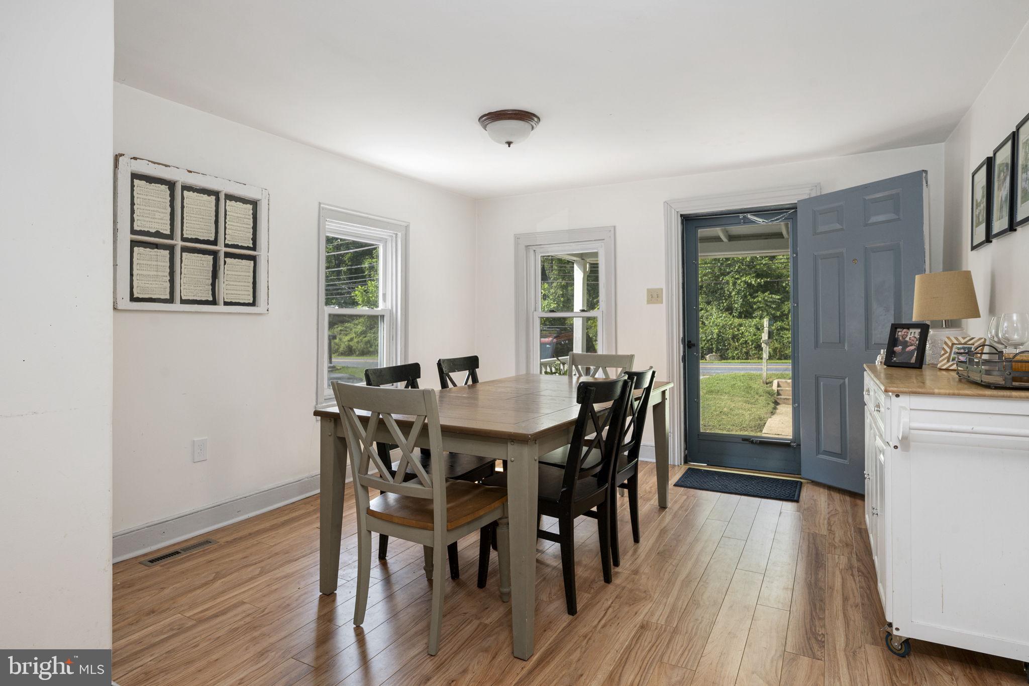 650 Fairview Road Glenmoore, PA 19343 - Photo 5 of 29 a view of a dining room with furniture and wooden floor