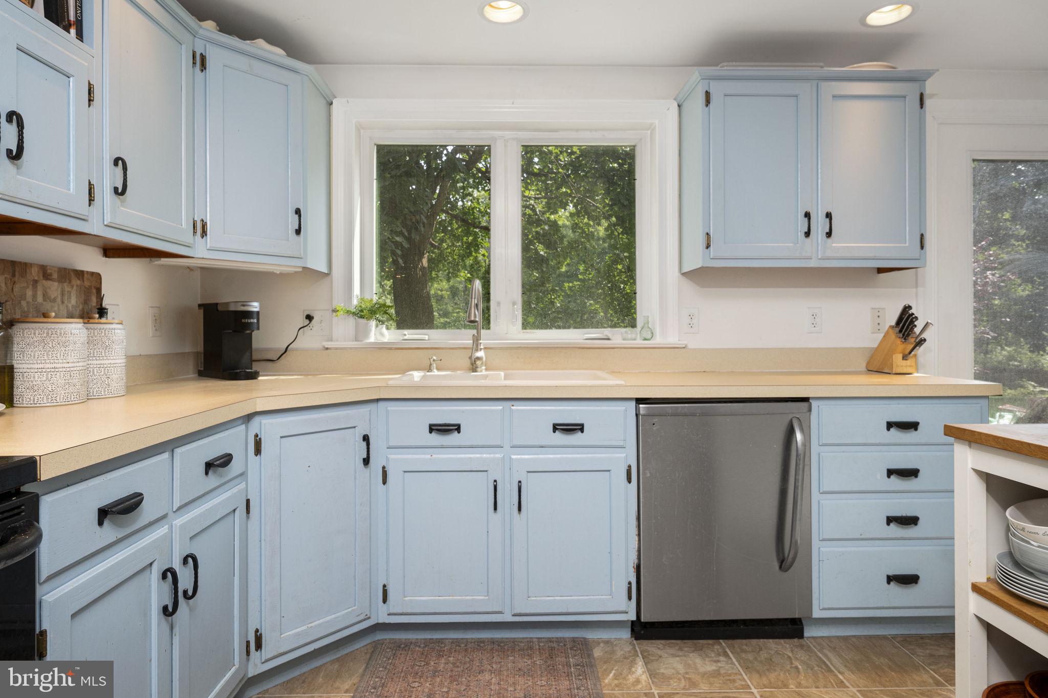 650 Fairview Road Glenmoore, PA 19343 - Photo 7 of 29 a kitchen with granite countertop white cabinets and a window