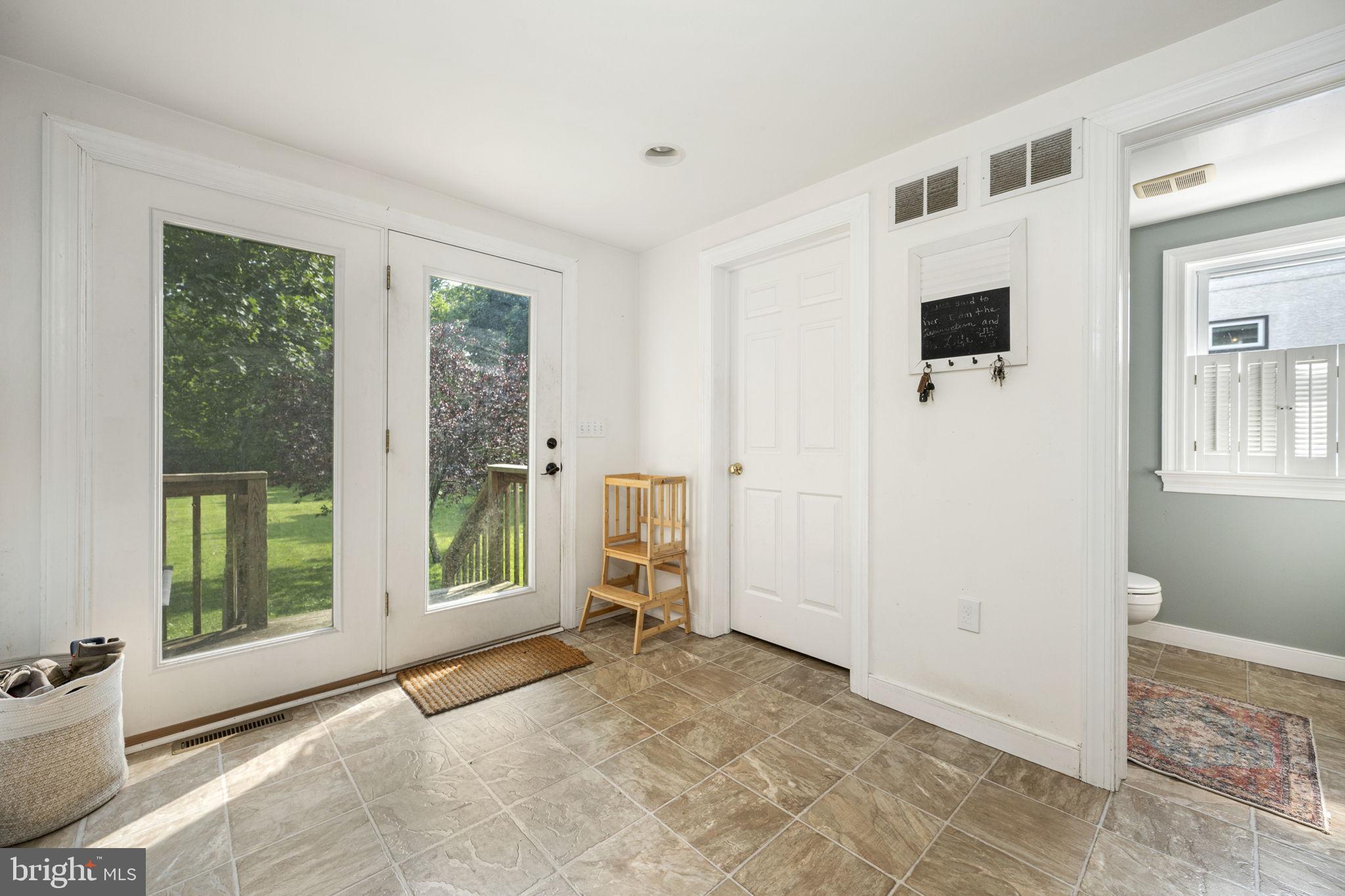 650 Fairview Road Glenmoore, PA 19343 - Photo 10 of 29 a view of a big room with windows and wardrobe