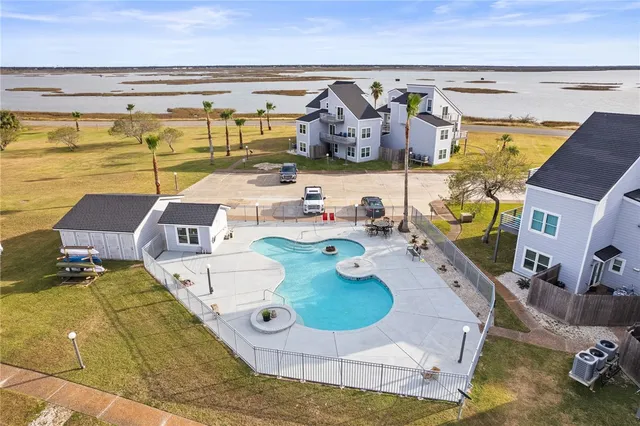 a view of a swimming pool and lounge chair