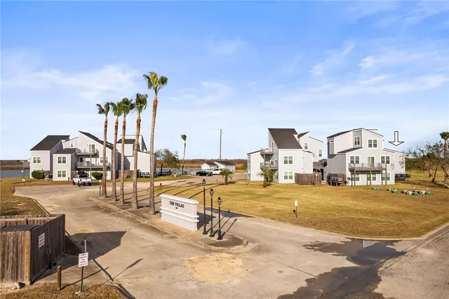 a view of a swimming pool and lounge chairs