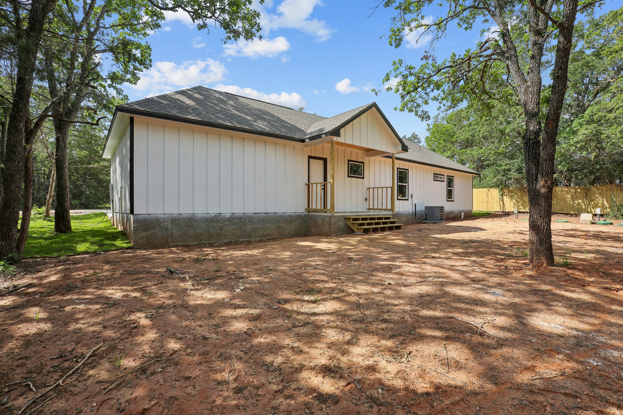 210 Flint Ridge Street Bastrop, TX 78602 - Photo 36 of 40 a view of a house with a backyard