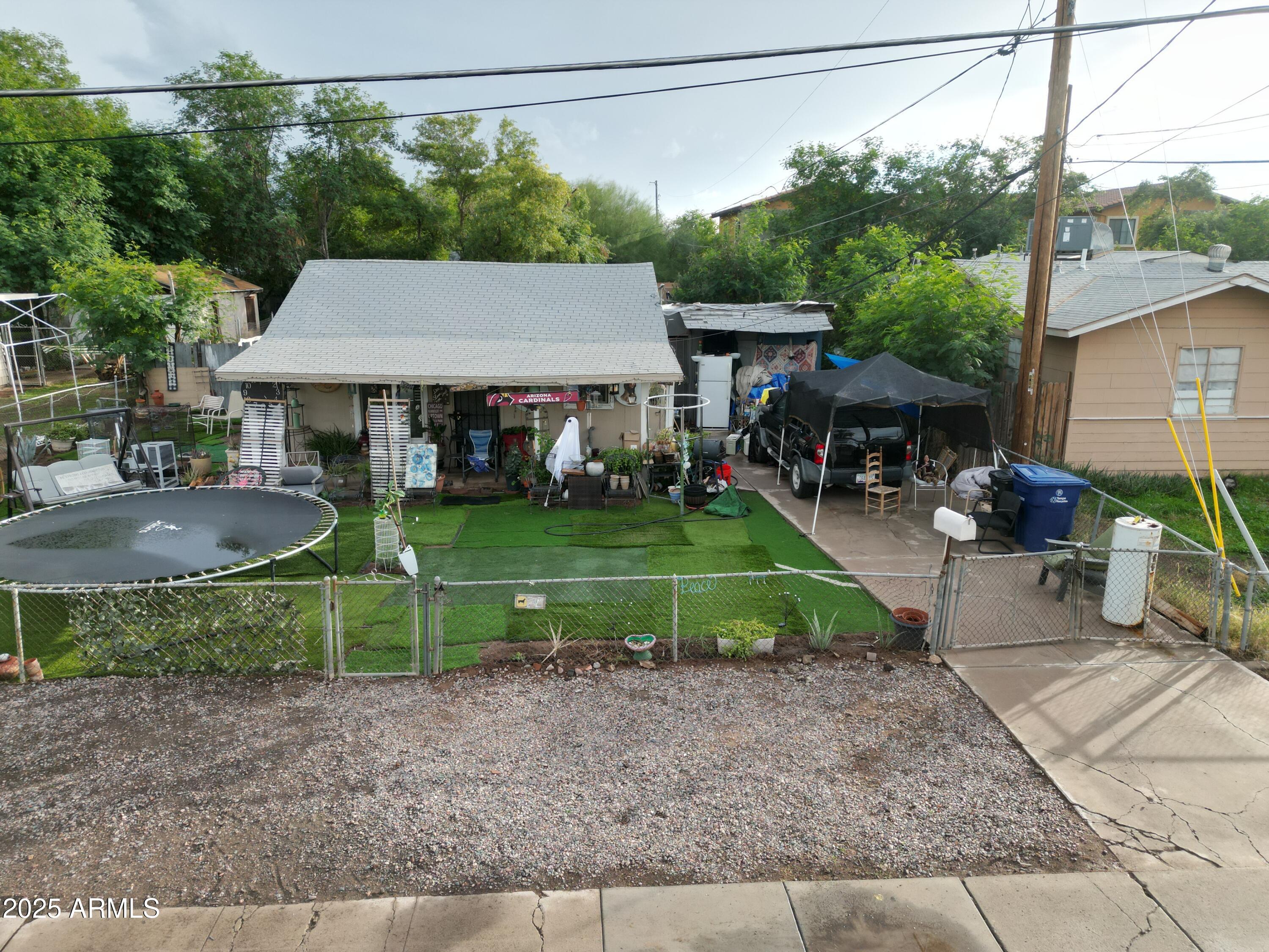 1229 East Spence Avenue Tempe, AZ 85281 - Photo 13 of 36 a view of a house with backyard sitting area and garden