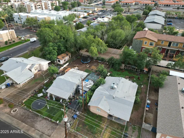 an aerial view of a house with outdoor space