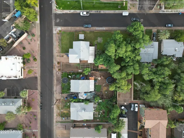an aerial view of a house with a yard