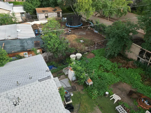 an aerial view of a house with outdoor space