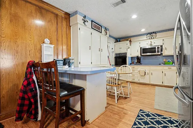 a workspace with furniture window and wooden floor
