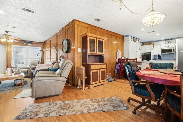 a bedroom with furniture and flat screen tv