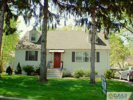 7 Morningside Road Colonia, NJ 07067 - Photo 2 of 2 a view of a house with a yard