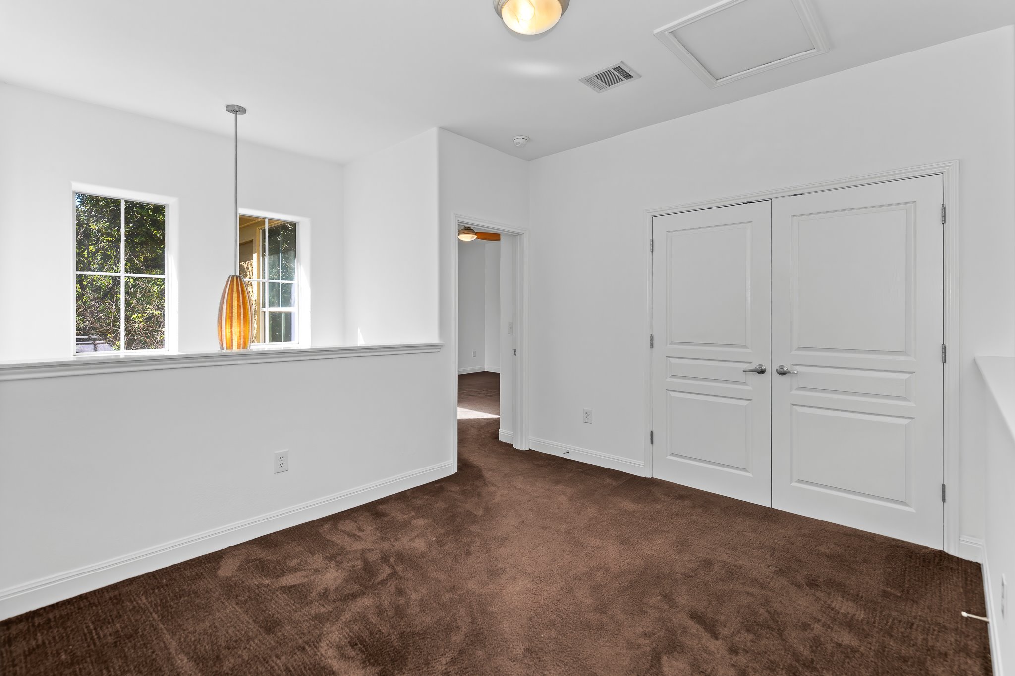 3406 Menchaca Road, Unit 28 Austin, TX 78704 - Photo 24 of 40 Unfurnished bedroom with dark colored carpet and a closet