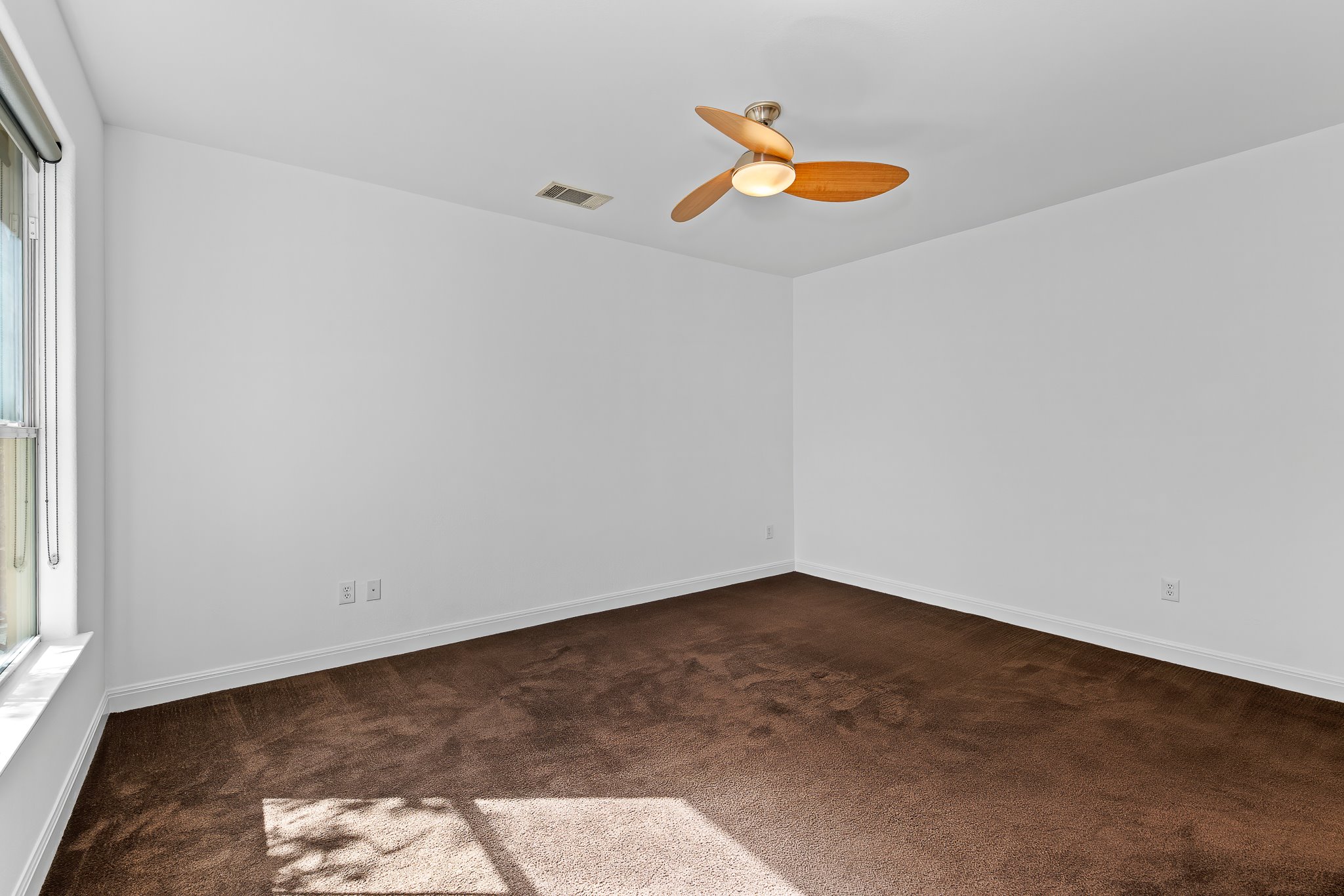 3406 Menchaca Road, Unit 28 Austin, TX 78704 - Photo 26 of 40 Unfurnished room featuring dark carpet and a ceiling fan
