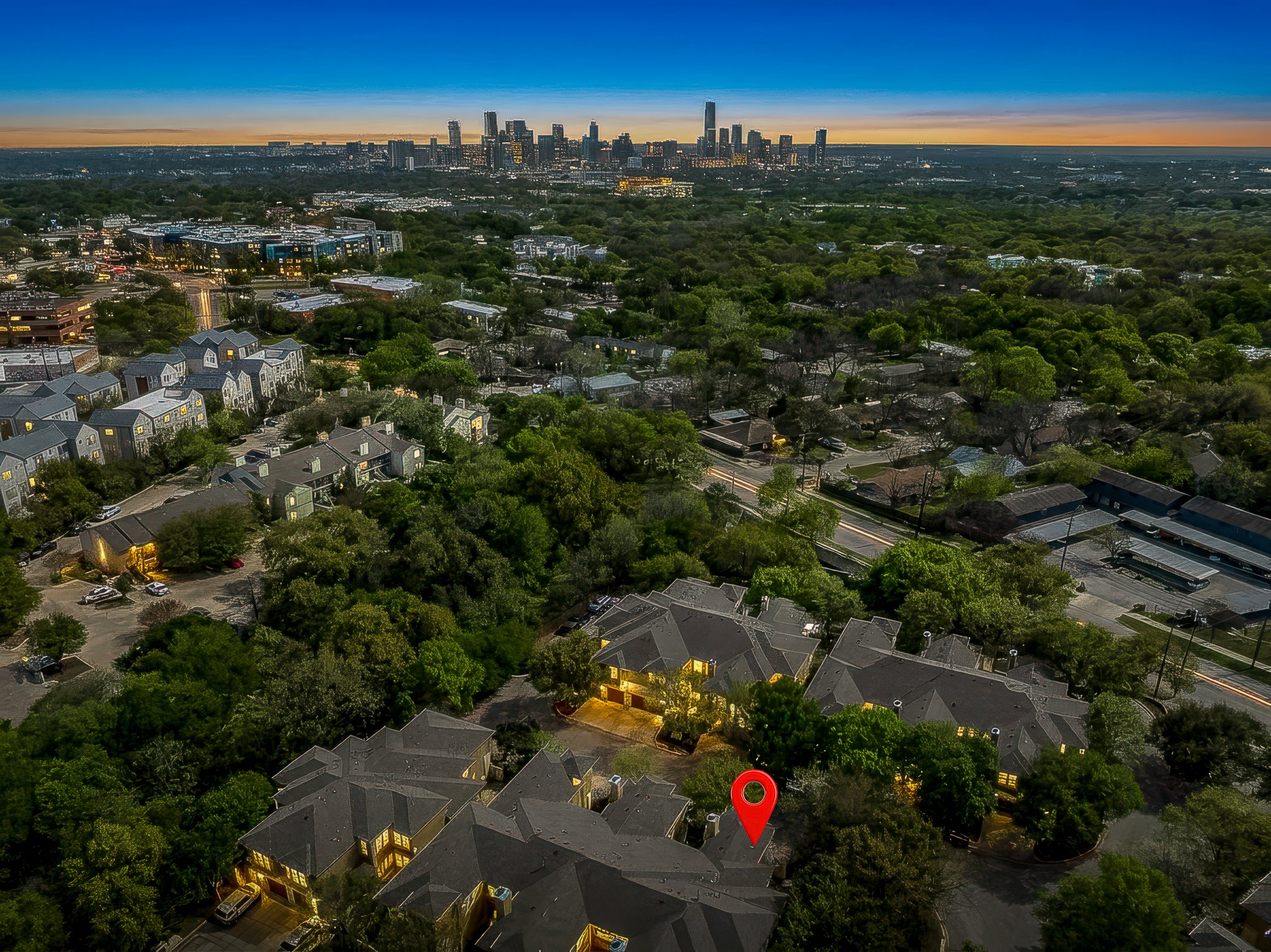 3406 Menchaca Road, Unit 28 Austin, TX 78704 - Photo 39 of 40 Aerial view at dusk of a view of skyline and a residential view