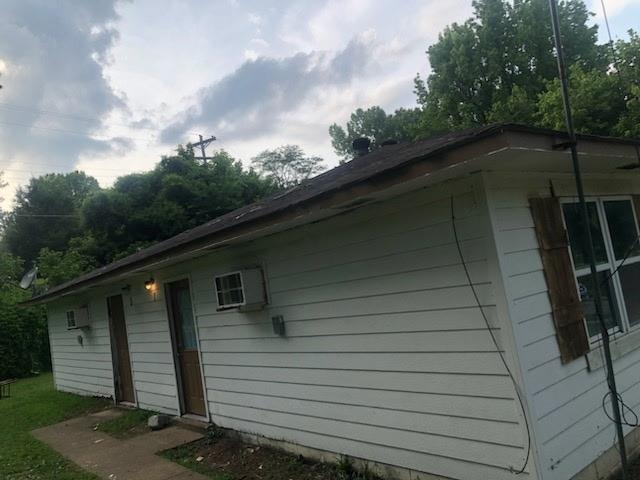 132 Stardust Drive Ripley, TN 38063 - Photo 4 of 10 White siding exterior with a dark shingle roof