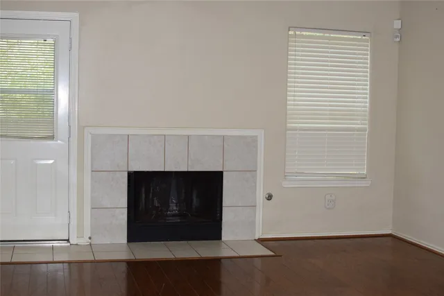 an empty room with fireplace