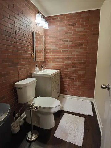 a bathroom with a toilet a sink and a shower