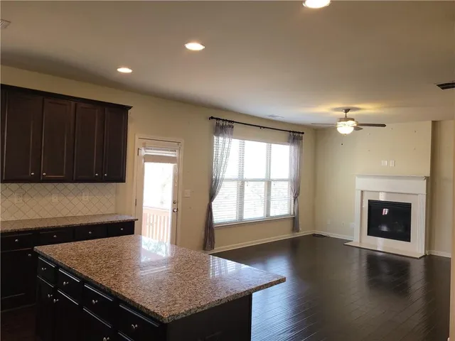 a kitchen with a stove a sink and a refrigerator