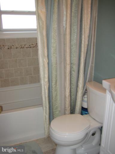 426 Stemmers Run Road Baltimore, MD 21221 - Photo 1 of 21 a white toilet sitting next to a bathtub