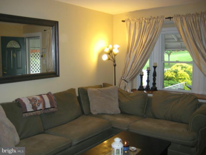 426 Stemmers Run Road Baltimore, MD 21221 - Photo 11 of 21 a living room with furniture and a window