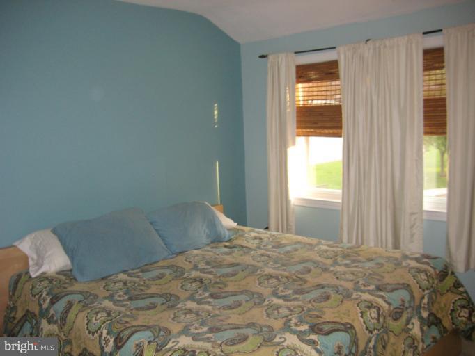 426 Stemmers Run Road Baltimore, MD 21221 - Photo 12 of 21 a bedroom with a bed and a window