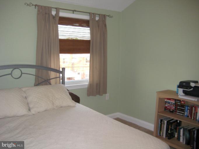 426 Stemmers Run Road Baltimore, MD 21221 - Photo 16 of 21 a bedroom with a bed and a window