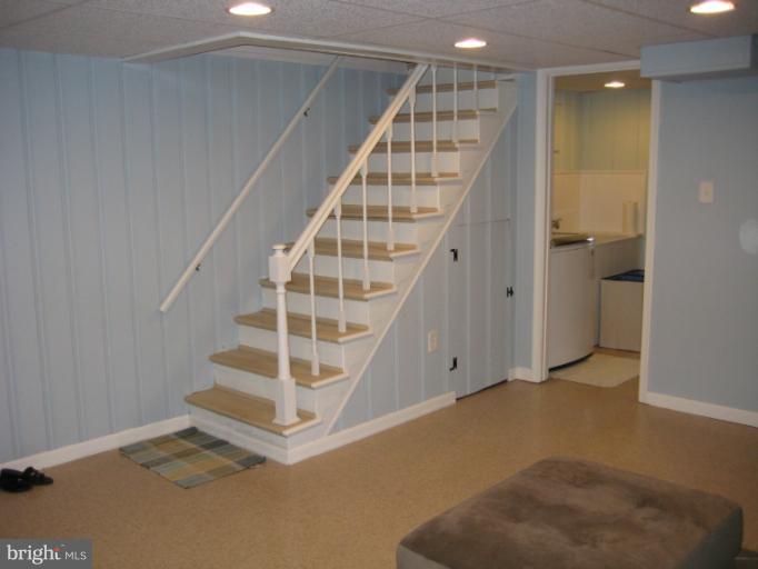 426 Stemmers Run Road Baltimore, MD 21221 - Photo 17 of 21 a view of staircase with white walls and windows