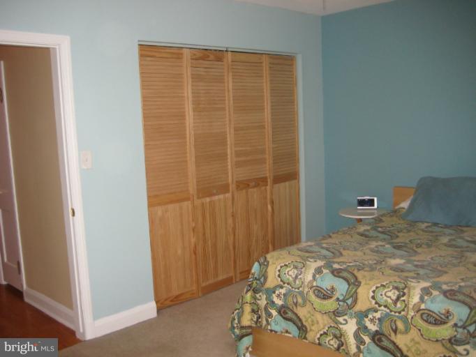 426 Stemmers Run Road Baltimore, MD 21221 - Photo 18 of 21 a bedroom with a bed and a window