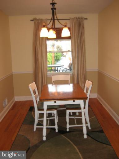 426 Stemmers Run Road Baltimore, MD 21221 - Photo 20 of 21 a view of a dining room with furniture and a window