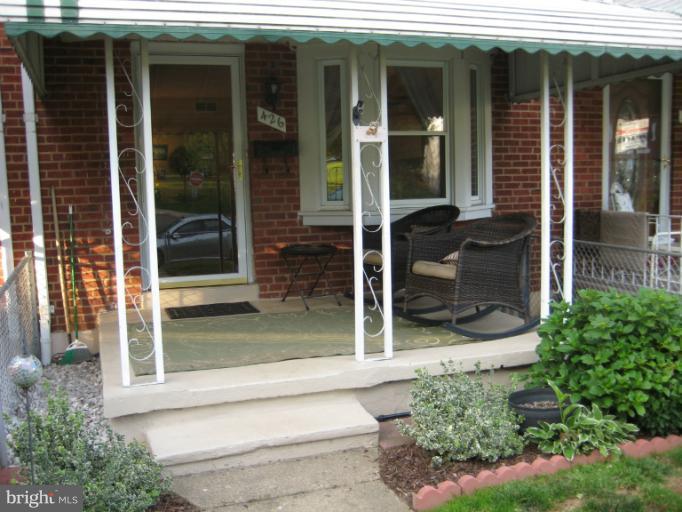 426 Stemmers Run Road Baltimore, MD 21221 - Photo 3 of 21 a view of a door of the house with a glass door and a yard